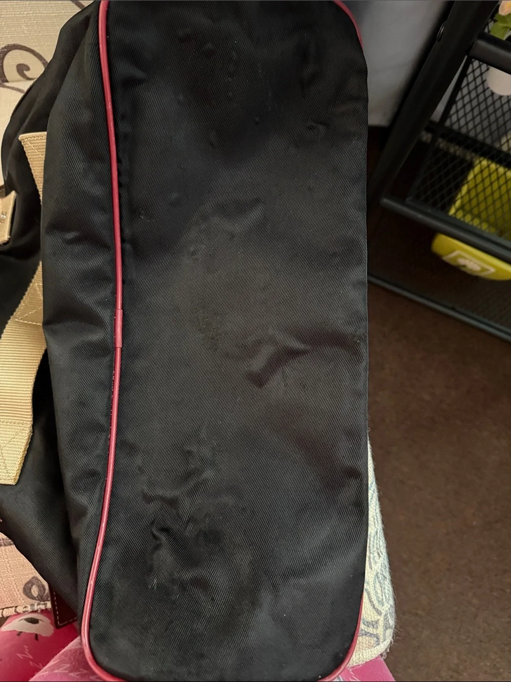 Black Duffel Bag with Tan Handles and Brown Accents